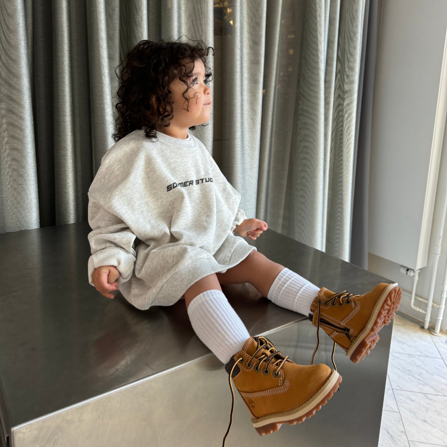 Kid in grey crewneck